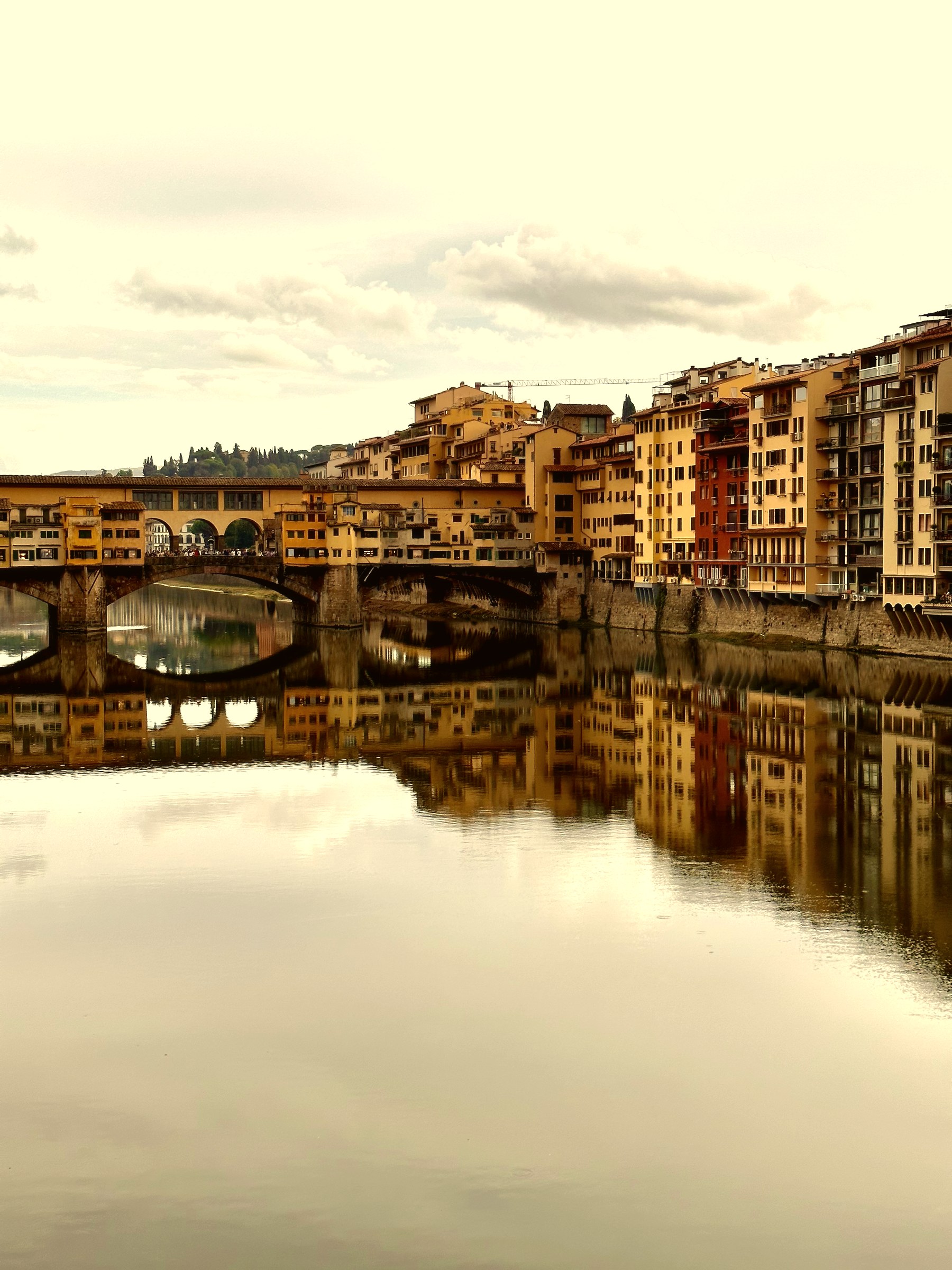 Ponte Vecchio reflecting on the Arno river, Florence, Italy, heritage of Massimiliano Musina's origins